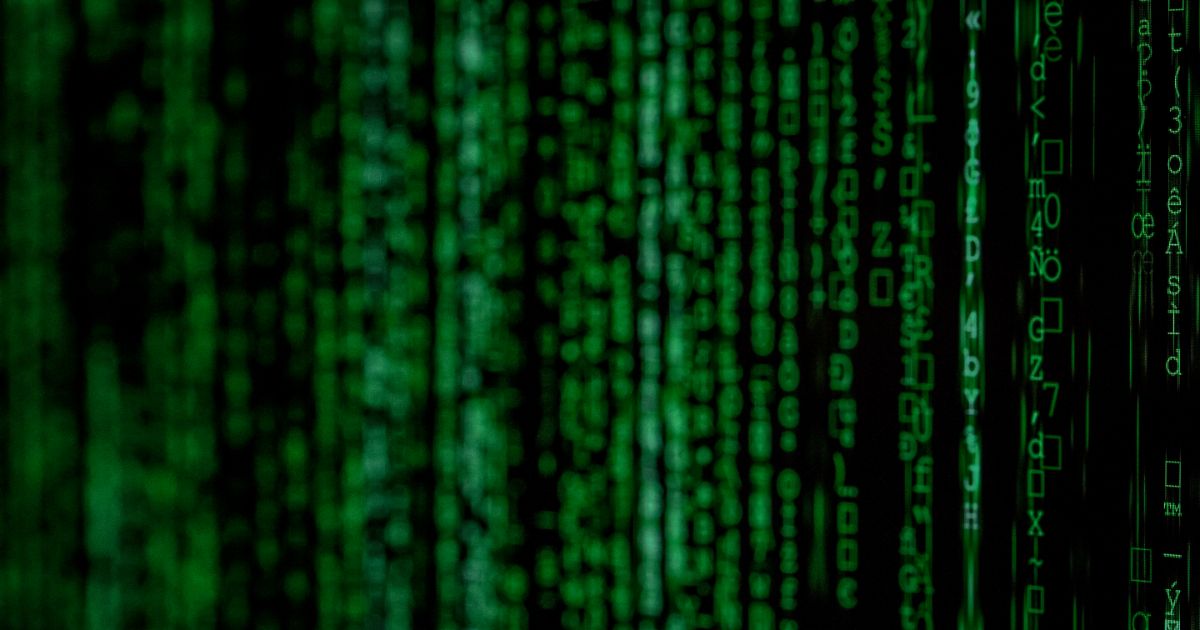 Green code cascading down a black background, resembling the "Matrix" aesthetic.