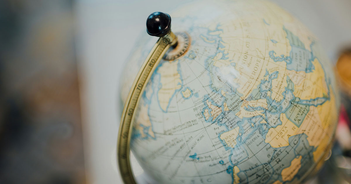 A globe featuring a black handle, symbolizing User-Centered Design for Multilingual Audiences.
