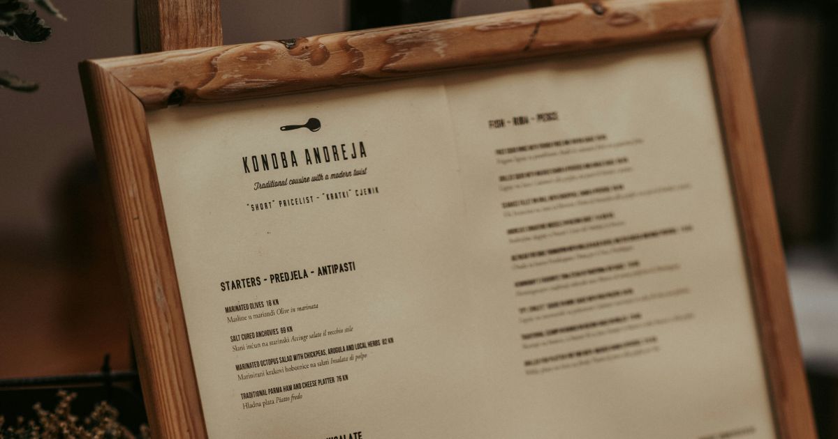 A wooden frame showcases a menu, symbolizing structured choices in information architecture and user navigation.