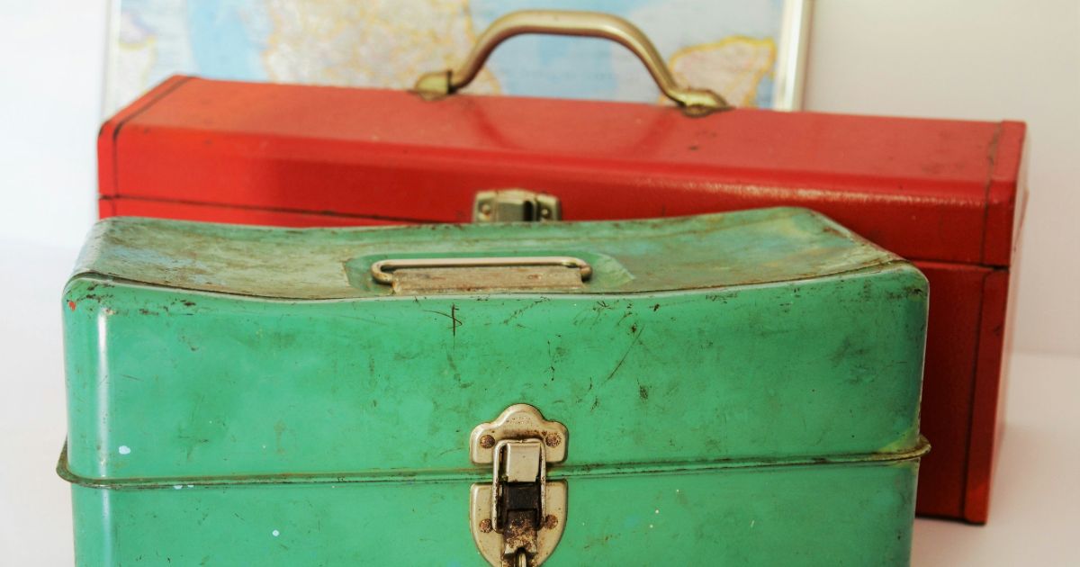 A vintage metal box featuring a charming red and green design, showcasing Accessibility Testing on a Budget