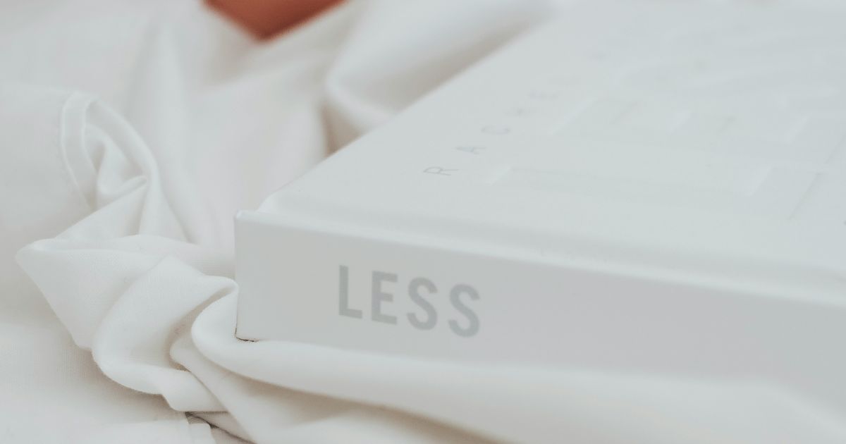 Cover of Less is More: The Ultimate Guide to Minimalism, featuring a clean, simple design with minimalist elements representing processing fluency in UX.