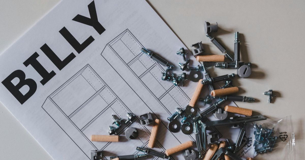 Billy reviews blueprints and sketches while planning for his new home representing the IKEA effect in UX.