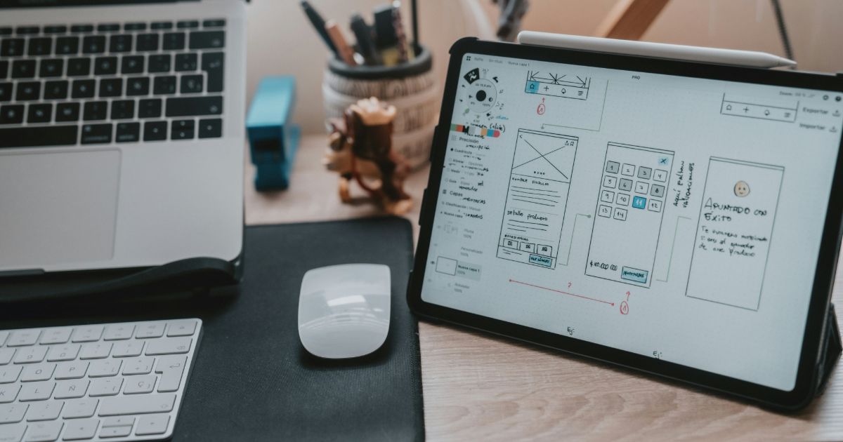 A person using a tablet to design a website, with design tools and a layout visible on the screen representing design systems 3.0.