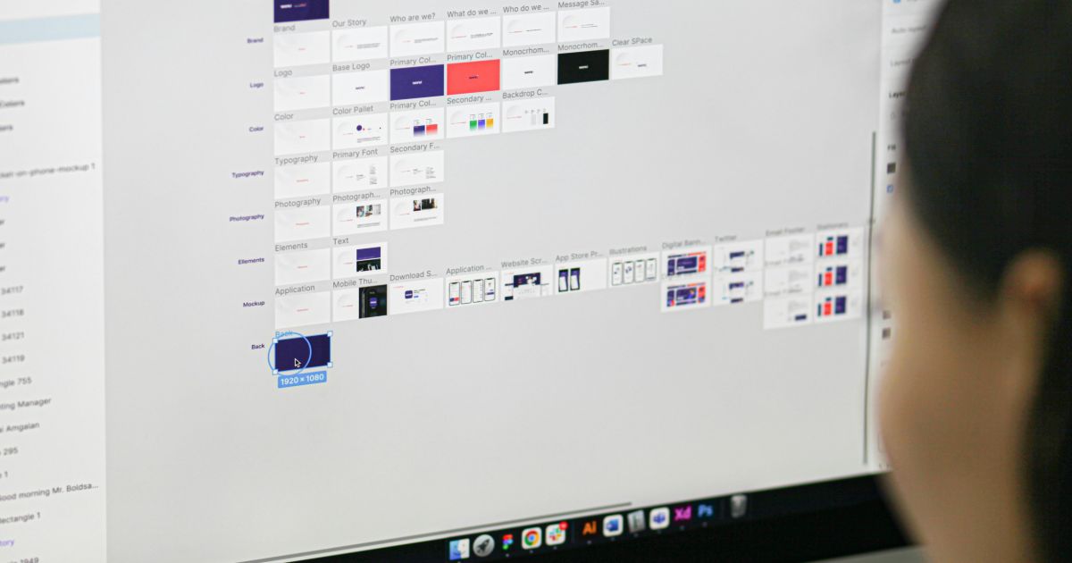 A woman gazes at a computer screen filled with various icons, indicating a busy digital workspace representing AI-driven DesignOps automation.