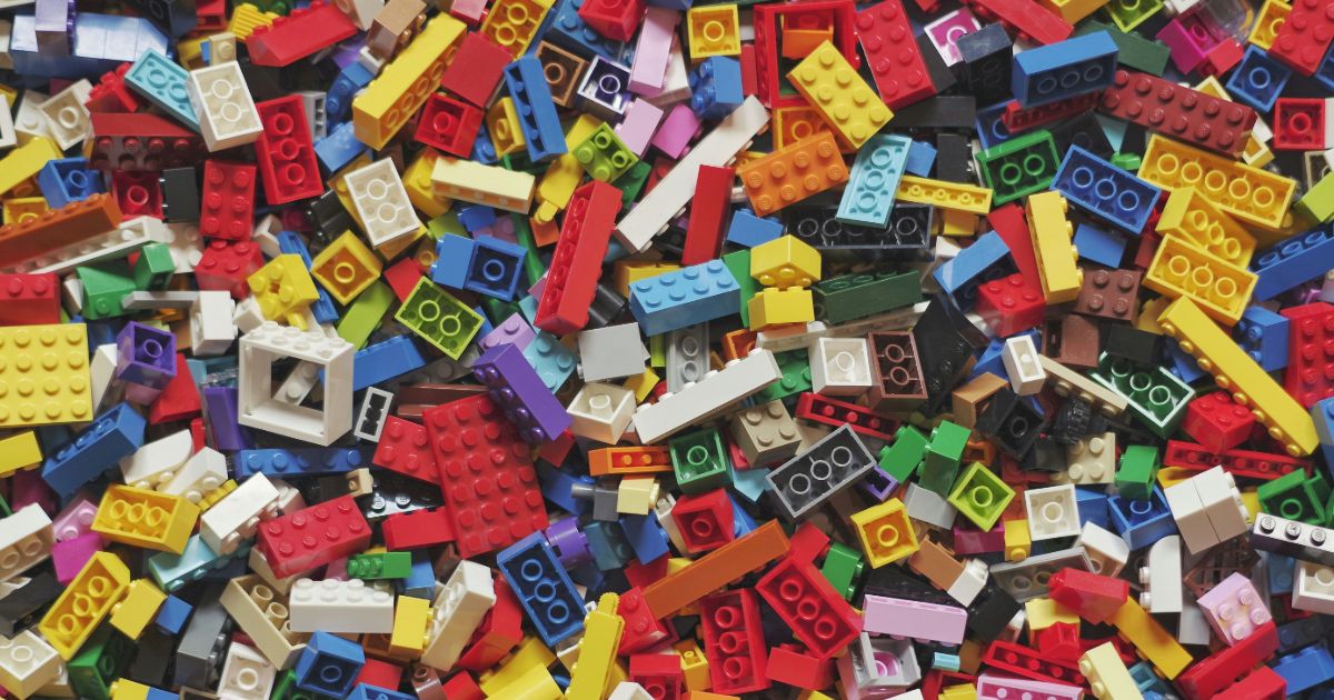 A colorful pile of assorted LEGO bricks in various shapes and sizes, ready for creative building and play representing modular information architecture.